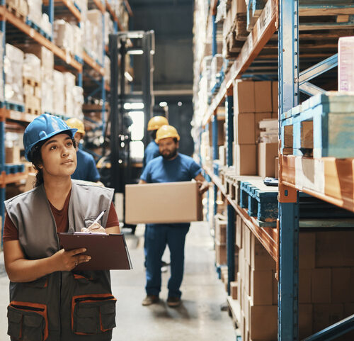 Close up of a group of workers working in a warehouse